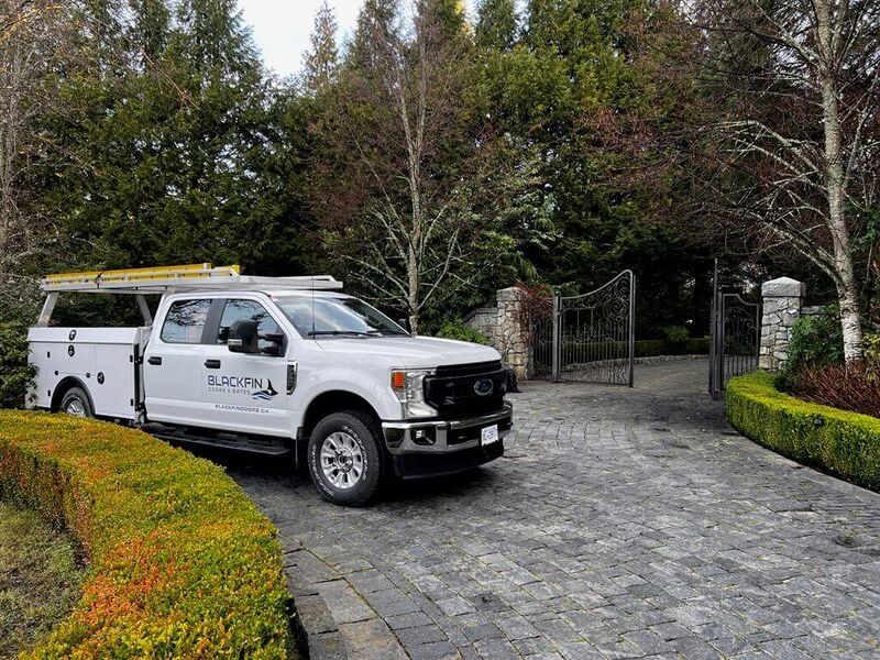 Truck on driveway outside gate.
